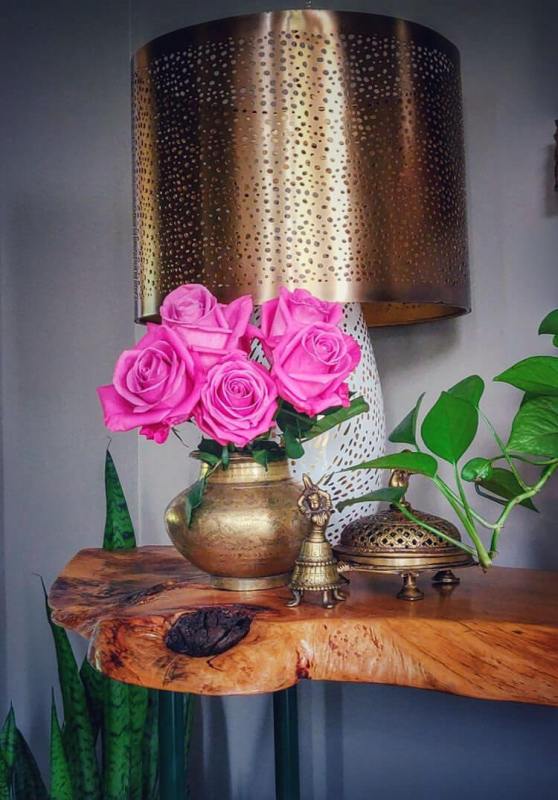 One look at Thenmozhi's home will transport you to India! With greenery and temple elements, this South Indian Home in USA glows with abundance and piety.
