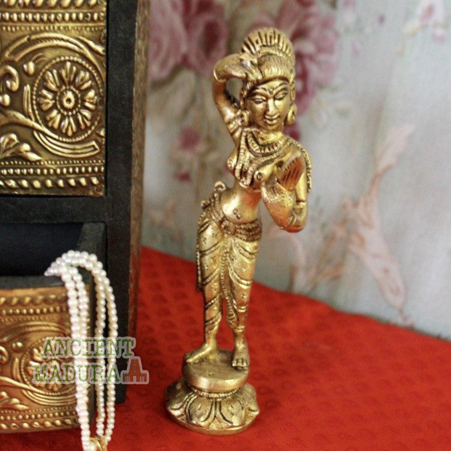 Brass lady with mirror