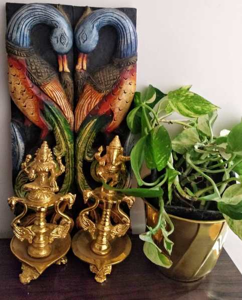 Traditional Paintings made by the home owner herself, along with antique brass artefacts make this Chennai Home truly Personal and Charming!