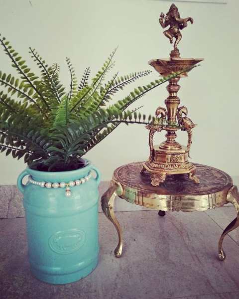 Traditional Paintings made by the home owner herself, along with antique brass artefacts make this Chennai Home truly Personal and Charming!