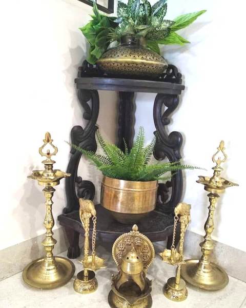 Traditional Paintings made by the home owner herself, along with antique brass artefacts make this Chennai Home truly Personal and Charming!