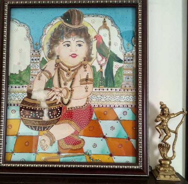 Traditional Paintings made by the home owner herself, along with antique brass artefacts make this Chennai Home truly Personal and Charming!