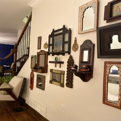 Mirror gallery under the stairs