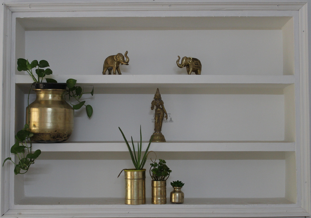 Brass planters in a showcase
