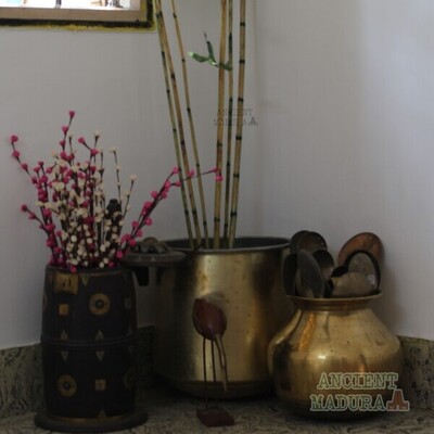 Artificial plants in brass vessels