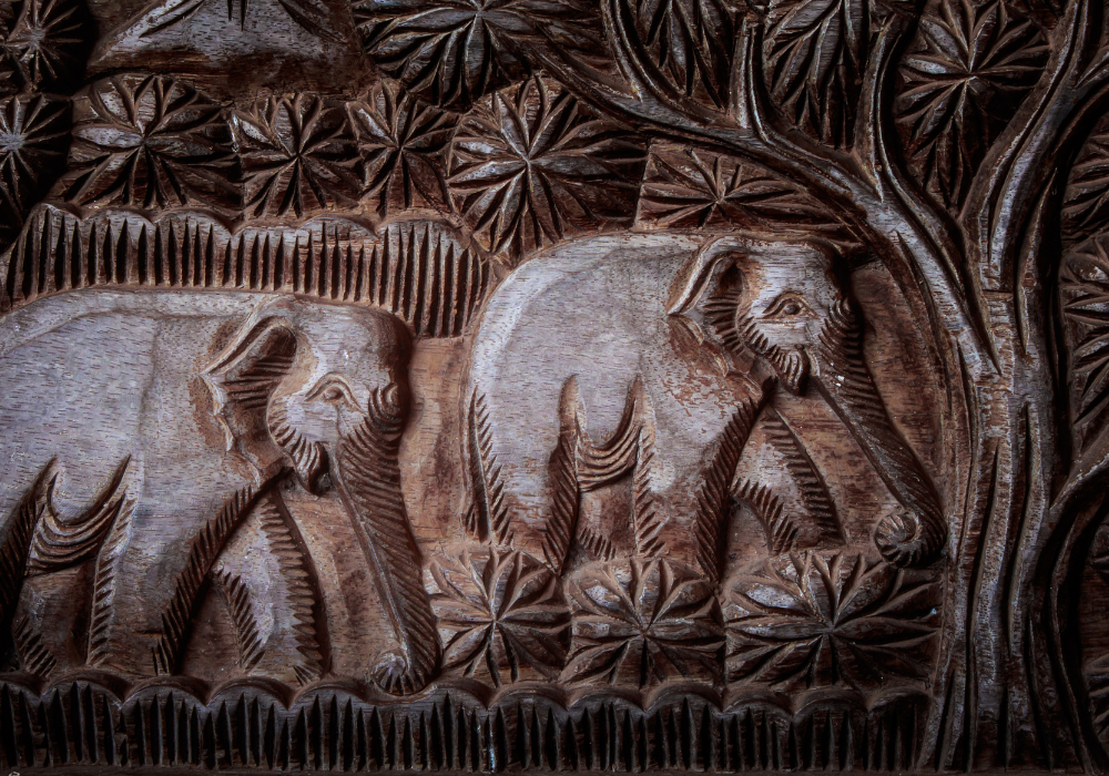 Wood panel with carved elephants