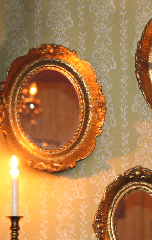 Wall with Brass framed mirrors