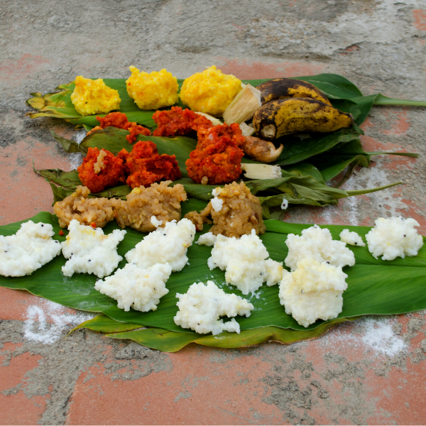 pongal dishes laid out on banana leaves