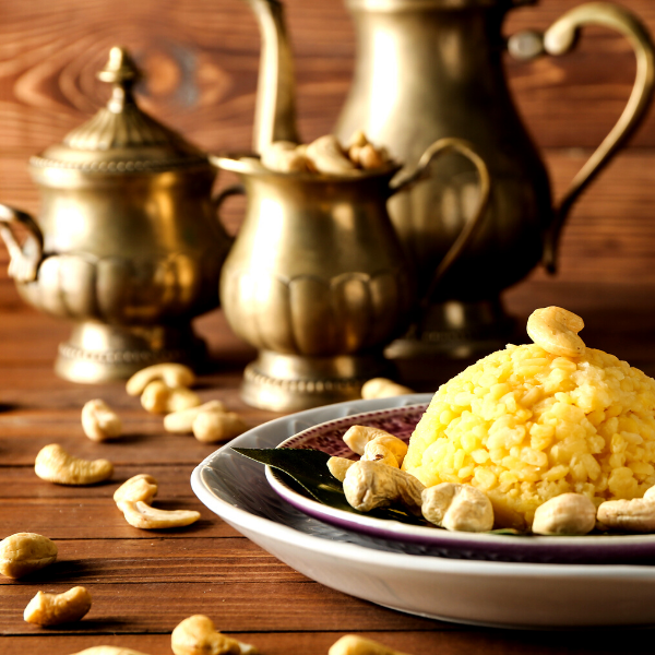 A plate of cooked pongal with cashews