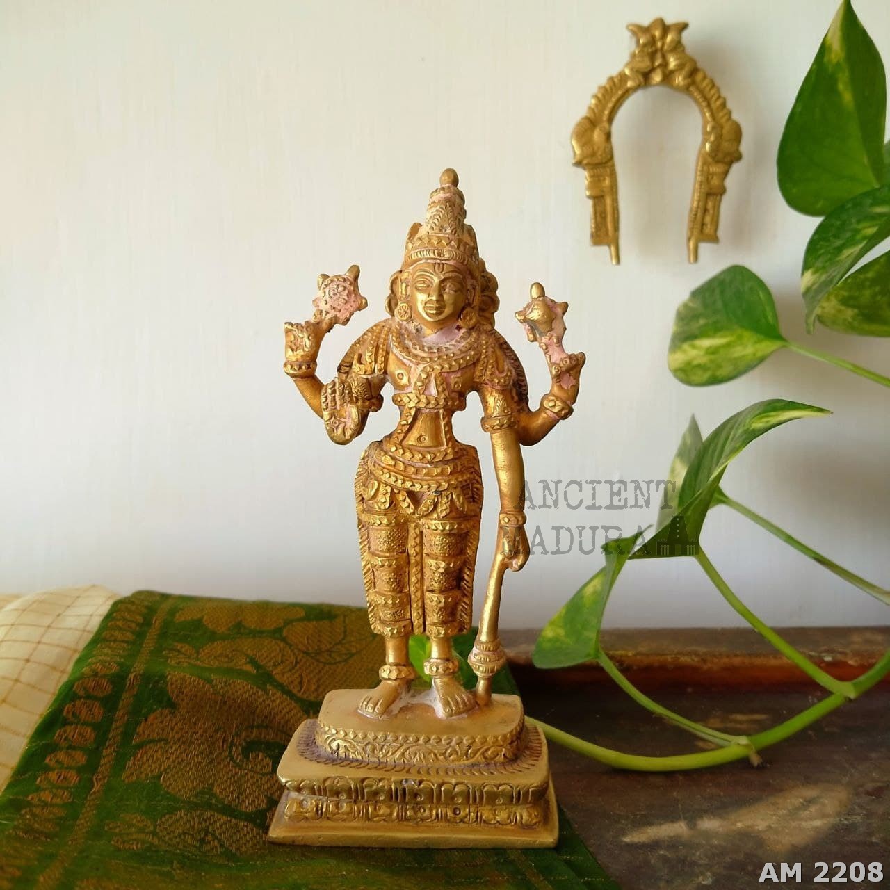 Brass Vishnu statue showing discoloration
