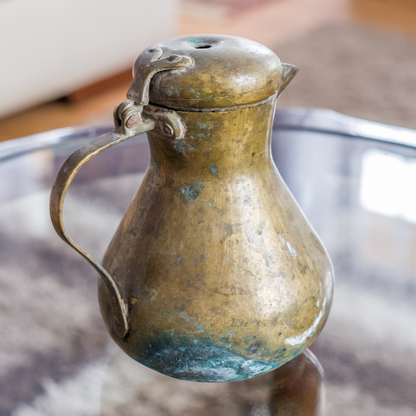 bras sjug showing extensive oxidation and patina