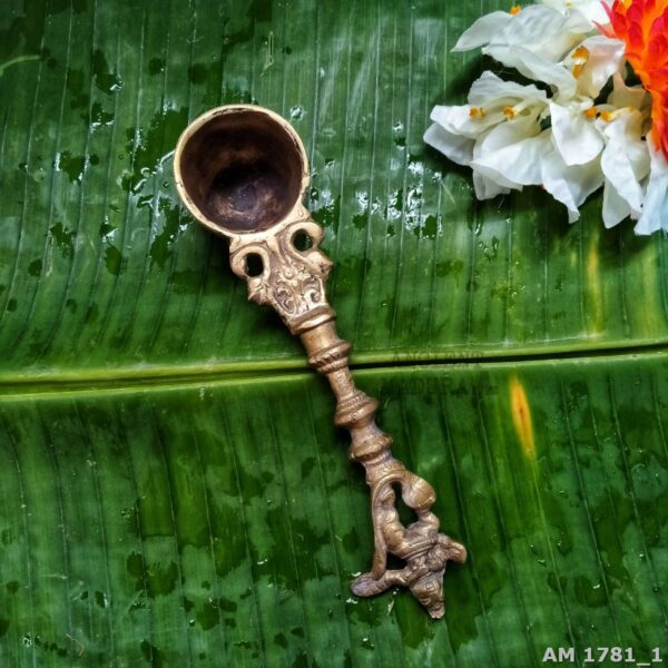 Brass teertha spoon showing brass discoloration