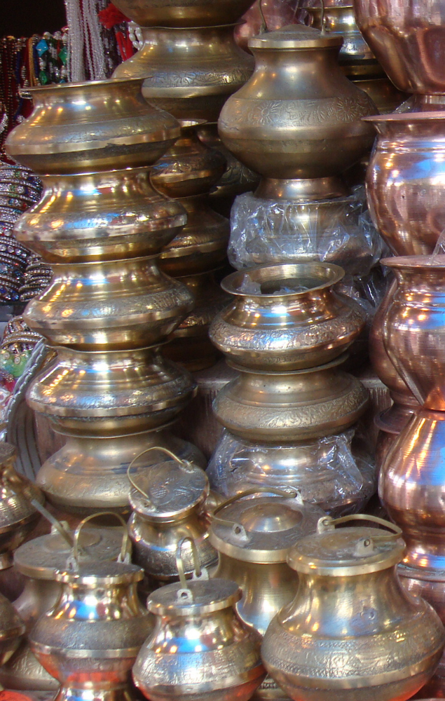 A store displaying brass vessels on sale