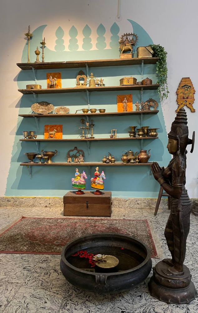 Shopping antiques in madurai : Shelves stocked up with brass and bronze pieces in the Ancient Madurai studio