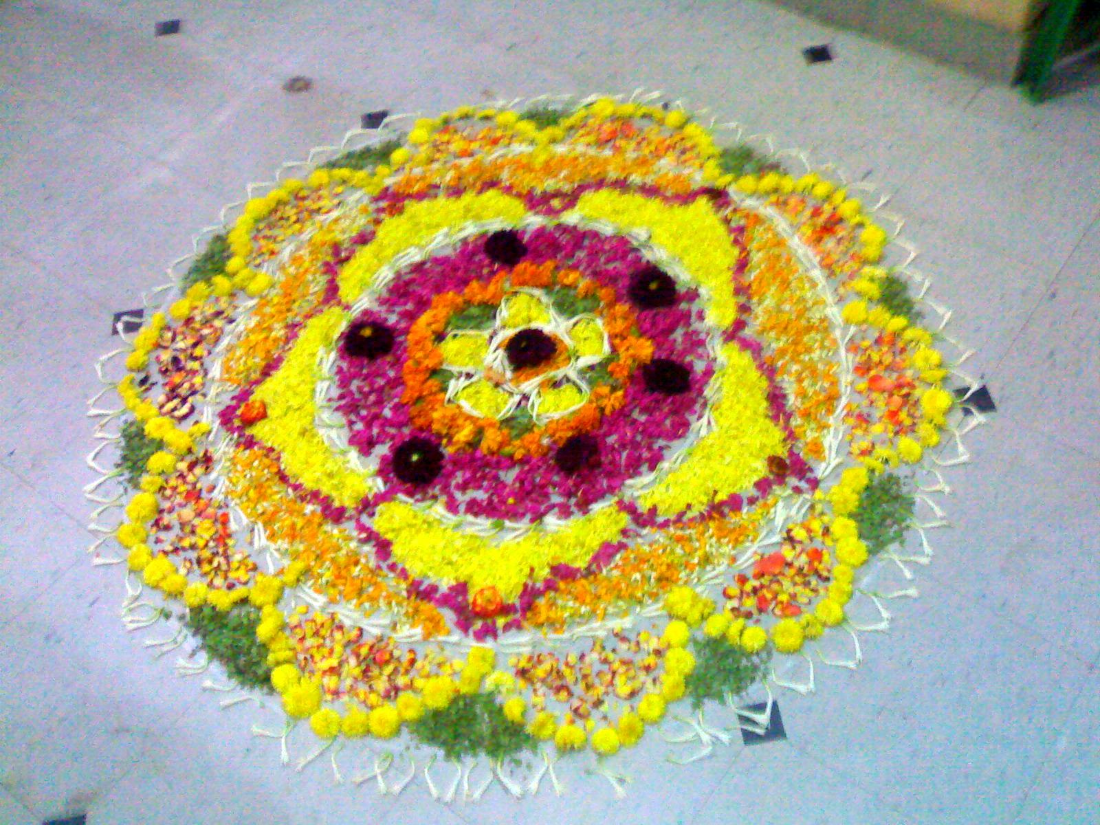 Rangoli on water and on festive ground: Onam flower rangoli also known as pookolam