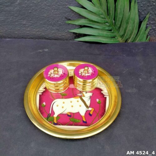 Elevate your pooja rituals with this Brass Kumkum Set featuring a wine-colored Pichwai plate and 2 round brass kumkum boxes. Perfect for pooja decoration, kumkum storage, festive occasions, and gifting.