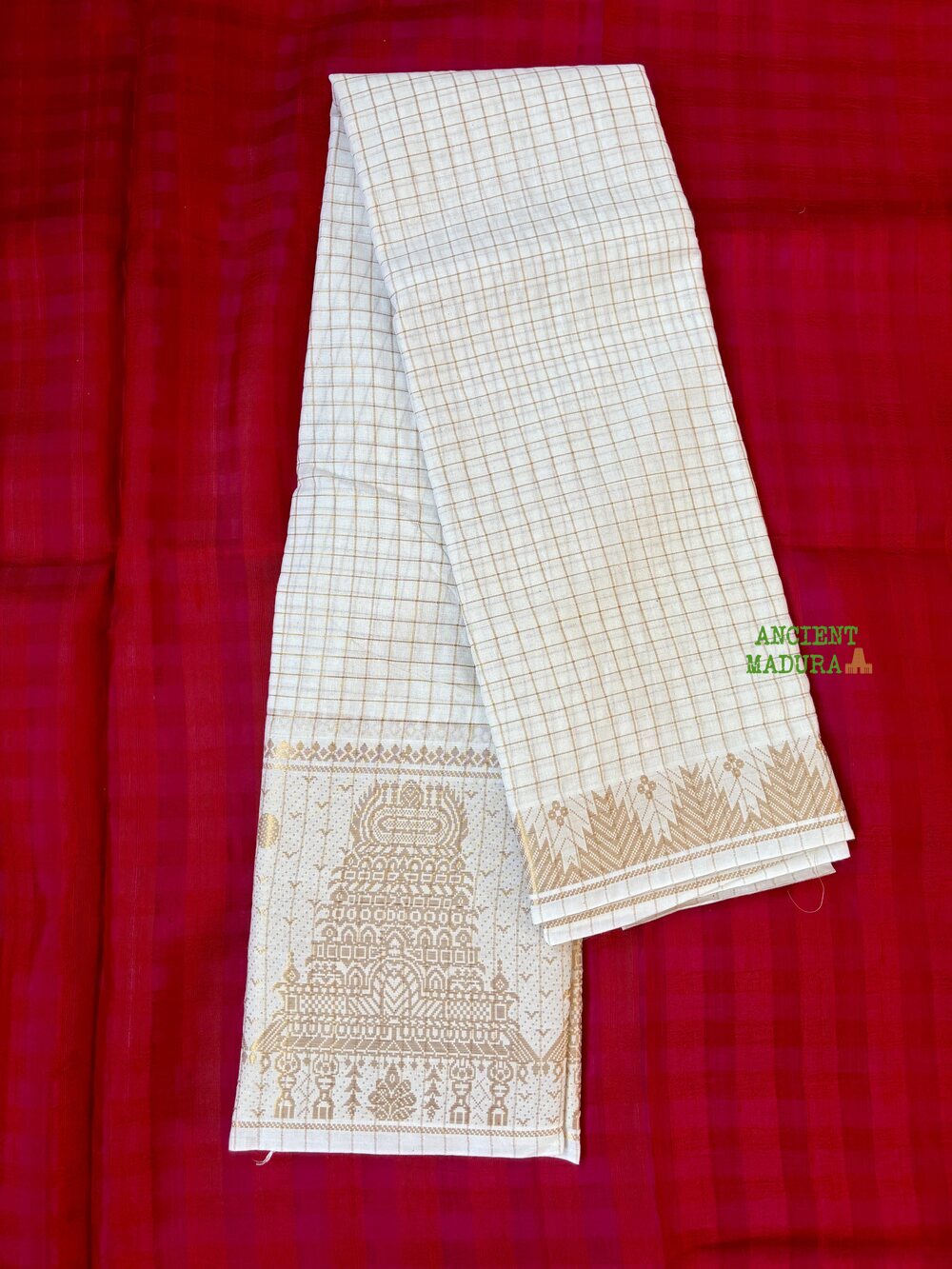 White premium gopuram border sungudi saree — pure white cotton with gold zari check lines and ornate temple motif border
