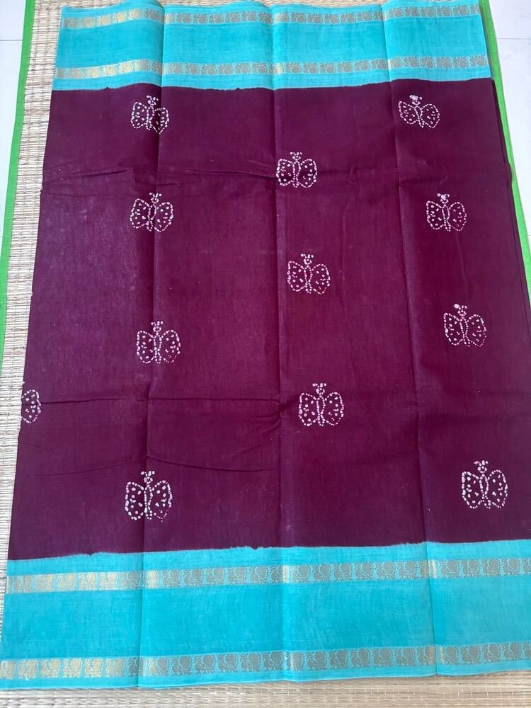 Dark brown premium 120 count batik sungudi cotton saree with white butterfly motif, turquoise Rettapet zari border, attached blouse, 90cm