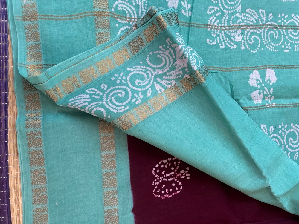 Dark brown premium 120 count batik sungudi cotton saree with white butterfly motif, turquoise Rettapet zari border, attached blouse, 90cm