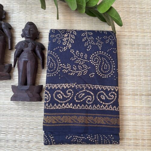 Navy blue sungudi batik saree with cream vine motifs, double mango border and framed floral pallu panels