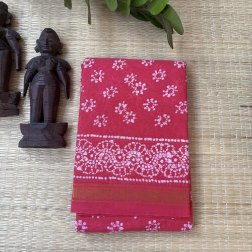 Pink sungudi batik saree with cream floral rosette motifs and gold zari border