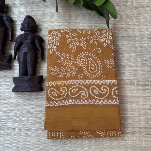 Mustard sungudi batik saree with cream vine motifs, double mango border and framed floral pallu panels