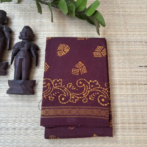 Brown sungudi batik saree with yellow striped wedge motifs and elaborate vine scroll pallu