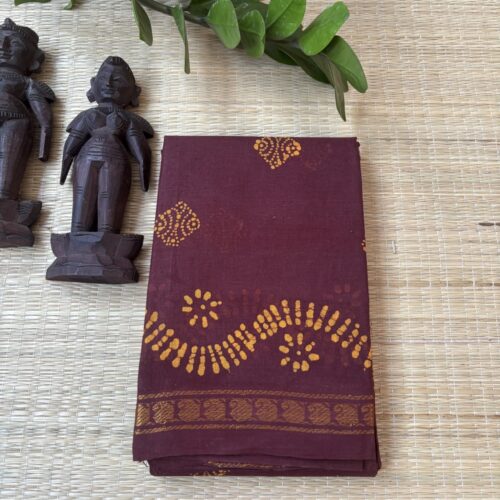 Brown sungudi batik saree with yellow diamond floral medallions and wavy vine pallu with paisley medallions