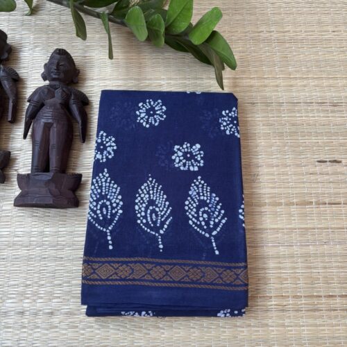 Indigo sungudi batik saree with white peacock feather motifs and diamond gold zari border