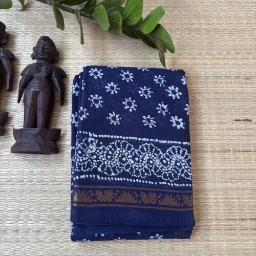 Indigo sungudi batik saree with white floral rosette motifs, bird and floral zari border and framed floral pallu with wave accents