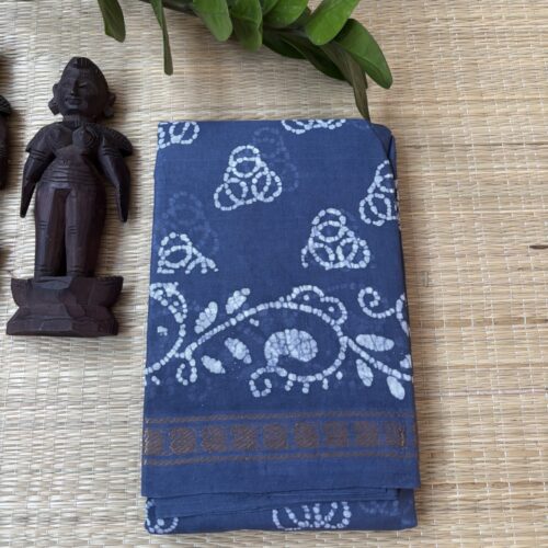 Slate blue sungudi batik saree with white tricircle cluster motifs, mango border and elaborate vine pallu