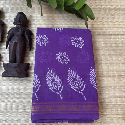 Purple sungudi batik saree with lilac peacock feather motifs and gold zari border