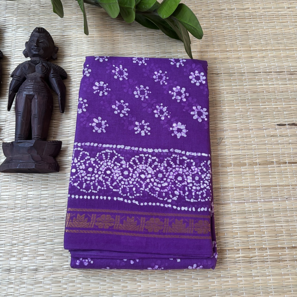 Purple sungudi batik saree with lilac peacock feather motifs and gold zari border