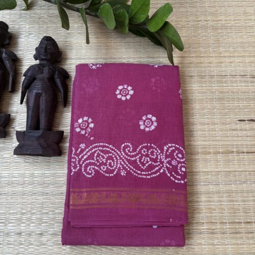 Onion pink sungudi batik saree with white floral rosette motifs, gold zari border and framed floral pallu with wave accents
