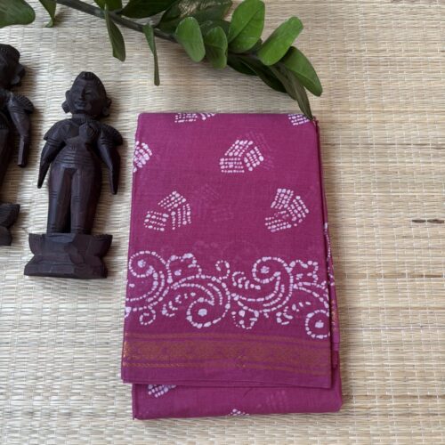 Onion pink batik saree with hand-tied striped wedge motifs scattered across the body and a dense vine scroll border and pallu, finished with a gold zari edge.
