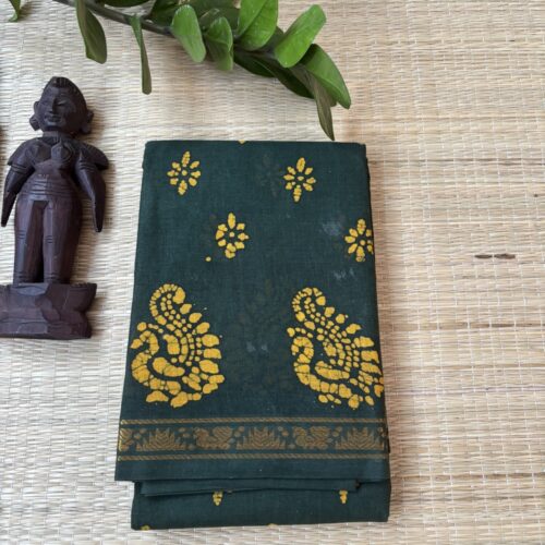 Bottle green batik saree with mustard yellow peacock motifs and floral rosette clusters