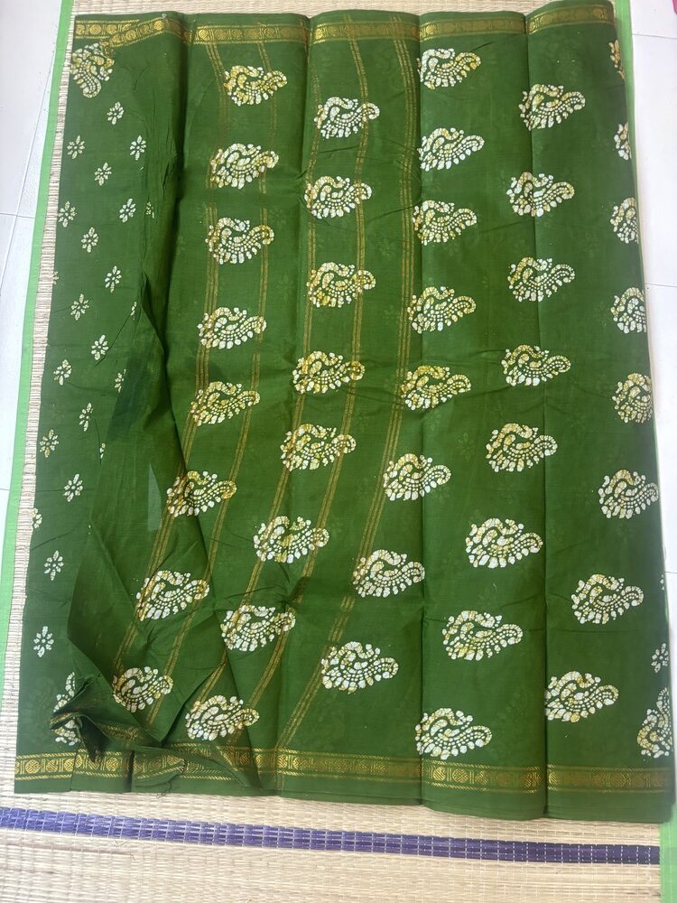 Leaf green sungudi batik saree with white and yellow-tinged peacock motifs and gold zari border