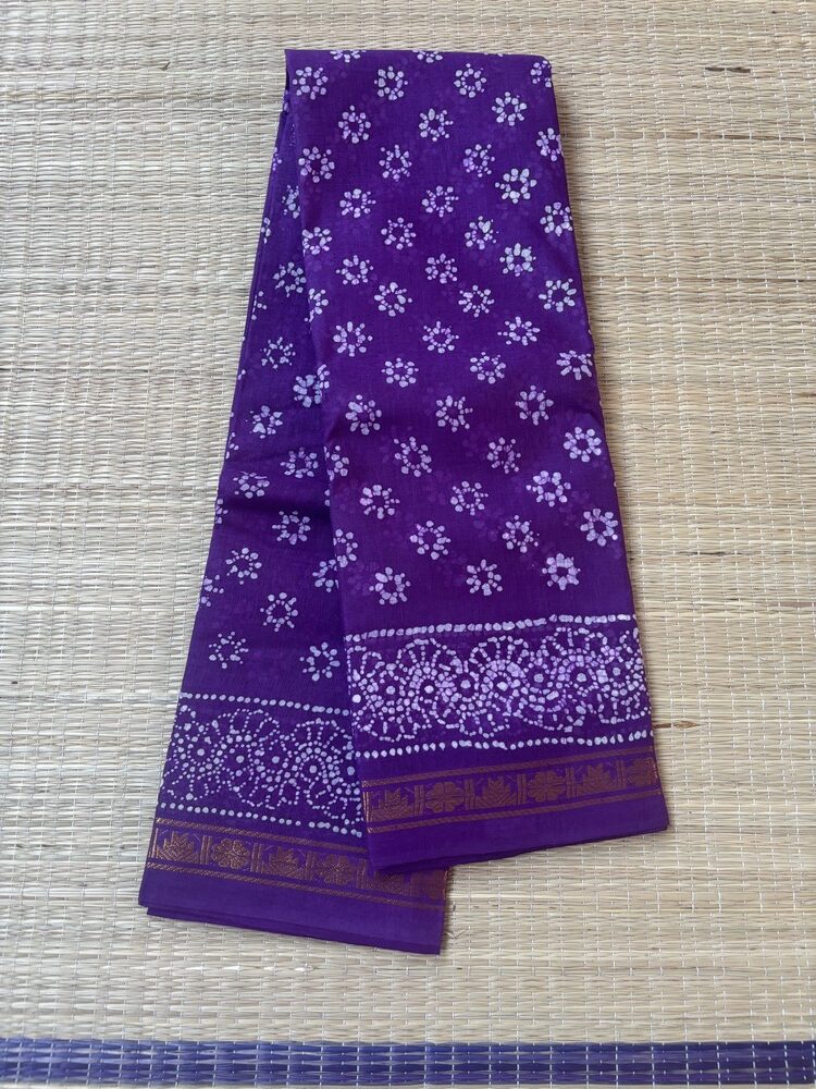 Purple sungudi batik saree with lilac peacock feather motifs and gold zari border