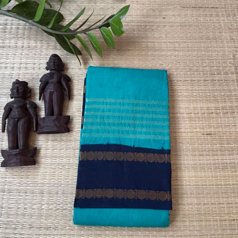Teal green Neli Velthari sungudi saree with navy Rettapet Rudraksha border, Madurai handcrafted cotton saree