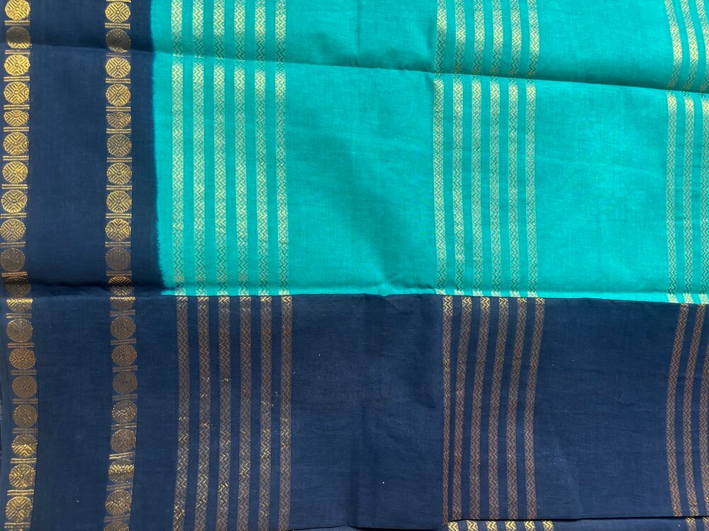 Teal green Neli Velthari sungudi saree with navy Rettapet Rudraksha border, Madurai handcrafted cotton saree